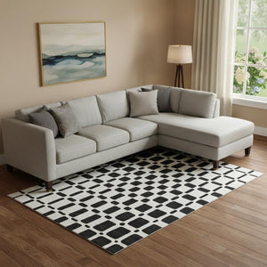 HomeRoots 9' X 12' Modern Black and Ivory Geometric Washable Area Rug with UV Protection for Busy Homes 669257