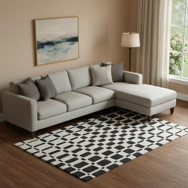 HomeRoots 10' X 14' Black And Ivory Geometric Area Rug - Stylish, Washable, UV-Protected for High-Traffic Spaces 669258