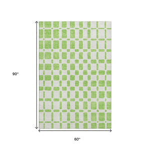 HomeRoots 5' Geometric Lime Green and Ivory Washable Area Rug – UV Protected, Durable & Kid-Friendly Design! 669284