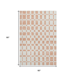 HomeRoots 5' X 8' Soft Peach and Ivory Geometric Area Rug - Durable, Washable, UV-Protected for Homes 669296
