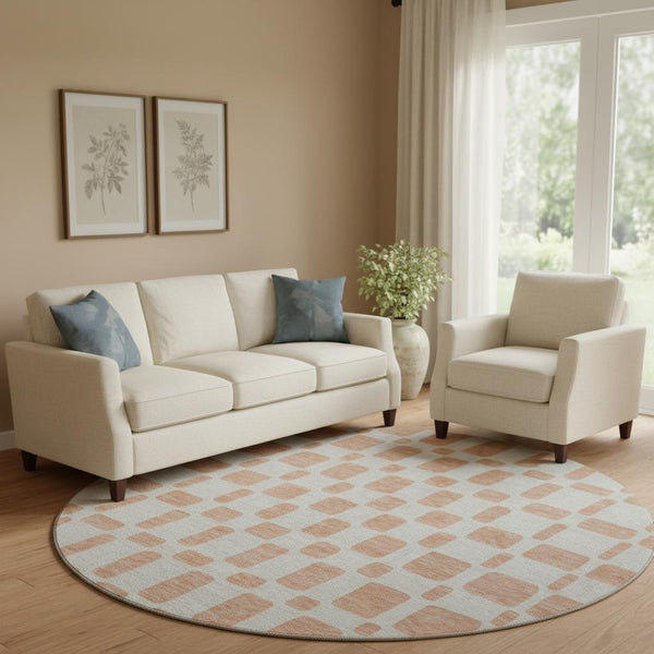 HomeRoots 8' Peach and Ivory Geometric Round Rug - Washable, UV Protected, Stain Resistant for Modern Spaces 669297