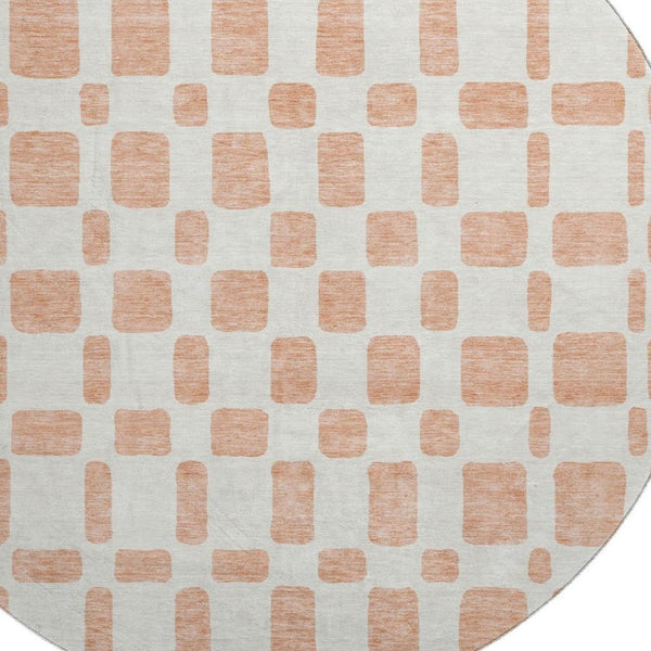 HomeRoots 8' Peach and Ivory Geometric Round Rug - Washable, UV Protected, Stain Resistant for Modern Spaces 669297