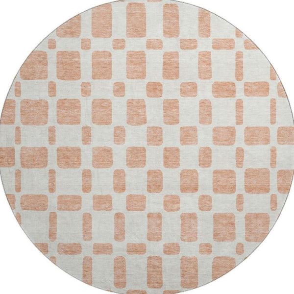 HomeRoots 8' Peach and Ivory Geometric Round Rug - Washable, UV Protected, Stain Resistant for Modern Spaces 669297