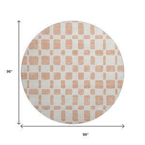 HomeRoots 8' Peach and Ivory Geometric Round Rug - Washable, UV Protected, Stain Resistant for Modern Spaces 669297