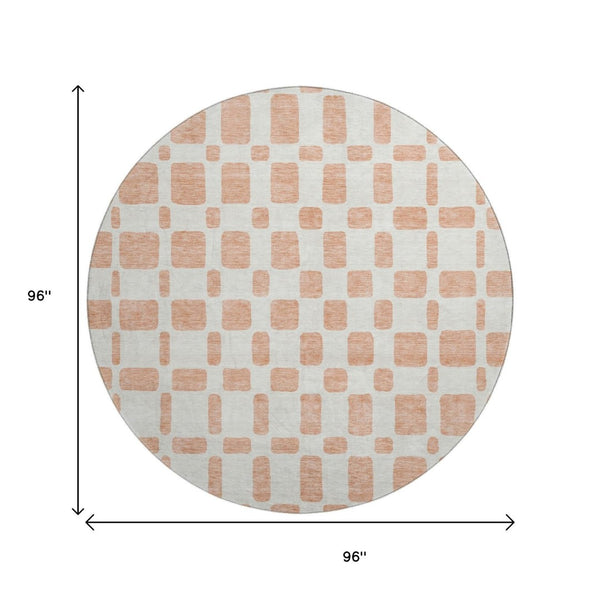 HomeRoots 8' Peach and Ivory Geometric Round Rug - Washable, UV Protected, Stain Resistant for Modern Spaces 669297
