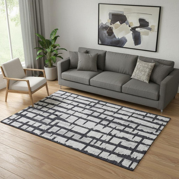HomeRoots 5' X 8' Stylish Black and Silver Striped Washable Area Rug with UV Protection for Any Room Decor 669344