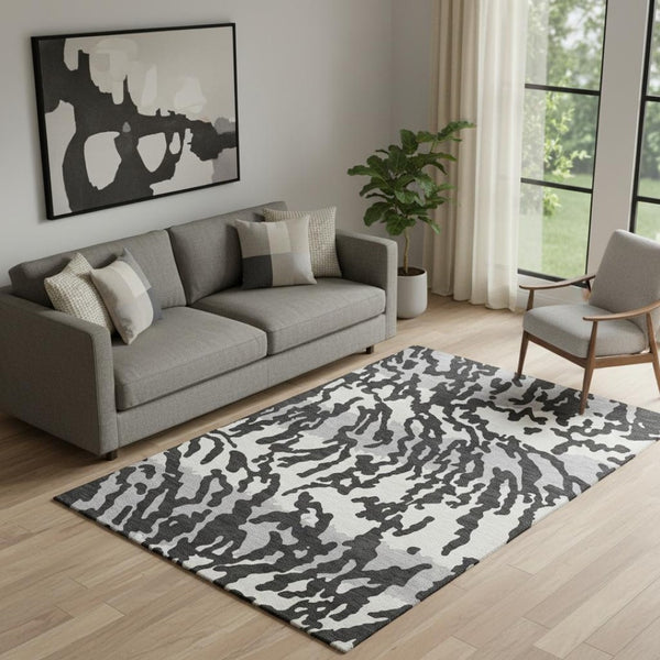 HomeRoots 5' X 8' Stylish Black and Ivory Animal Print Area Rug - Washable, UV-Protected, Pet-Friendly Design! 669422