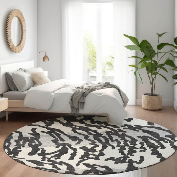 HomeRoots 8' Stylish Black and Ivory Animal Print Washable Round Rug with UV Protection for High Traffic Areas 669423