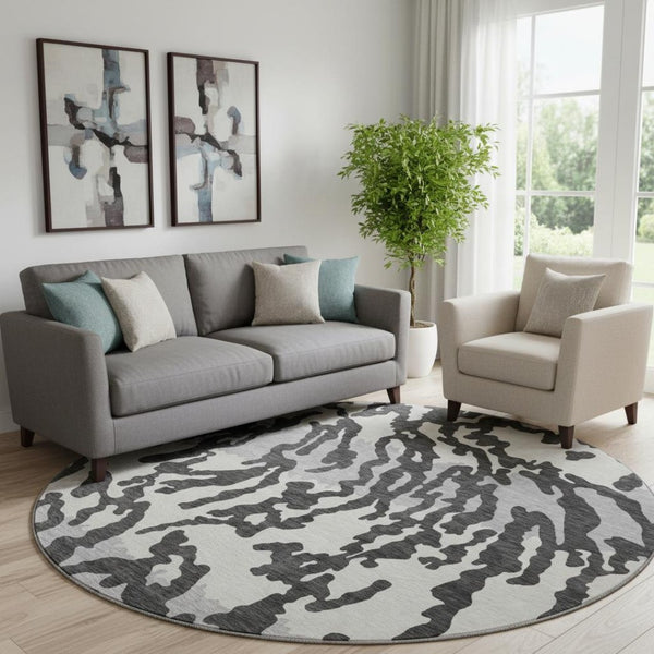 HomeRoots 8' Stylish Black and Ivory Animal Print Washable Round Rug with UV Protection for High Traffic Areas 669423