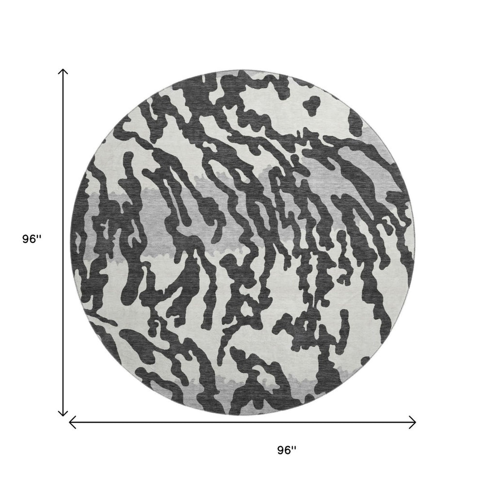 HomeRoots 8' Stylish Black and Ivory Animal Print Washable Round Rug with UV Protection for High Traffic Areas 669423