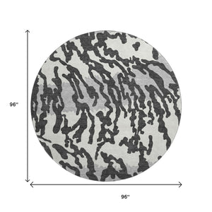 HomeRoots 8' Stylish Black and Ivory Animal Print Washable Round Rug with UV Protection for High Traffic Areas 669423