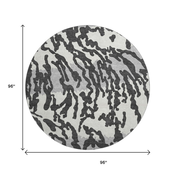 HomeRoots 8' Stylish Black and Ivory Animal Print Washable Round Rug with UV Protection for High Traffic Areas 669423