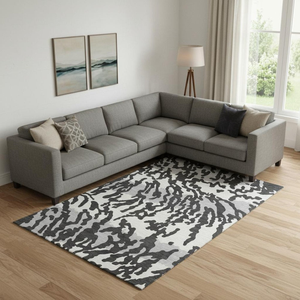 HomeRoots 8' X 10' Stylish Black and Ivory Animal Print Area Rug - Washable, UV Protected, Pet Friendly Design! 669424