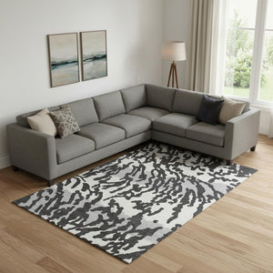 HomeRoots 8' X 10' Stylish Black and Ivory Animal Print Area Rug - Washable, UV Protected, Pet Friendly Design! 669424