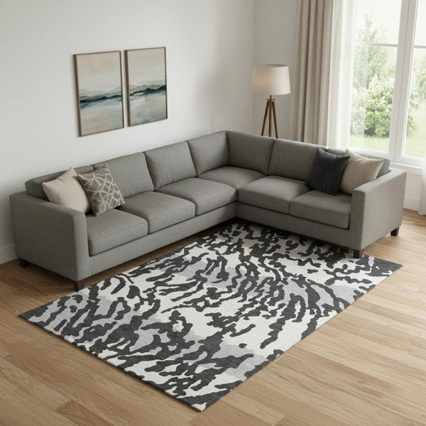HomeRoots 8' X 10' Stylish Black and Ivory Animal Print Area Rug - Washable, UV Protected, Pet Friendly Design! 669424