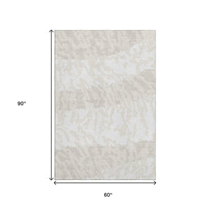 HomeRoots 5' X 8' Ivory and Beige Animal Print Area Rug - Washable, UV Protected, Perfect for Family Spaces! 669452