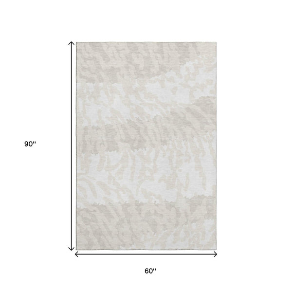 HomeRoots 5' X 8' Ivory and Beige Animal Print Area Rug - Washable, UV Protected, Perfect for Family Spaces! 669452