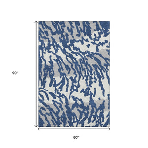 HomeRoots 5' X 8' Stylish Navy Blue & Ivory Animal Print Area Rug - Washable, UV-Protected, Pet-Friendly Design 669458