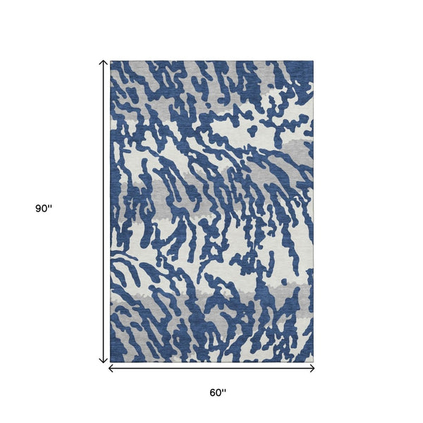 HomeRoots 5' X 8' Stylish Navy Blue & Ivory Animal Print Area Rug - Washable, UV-Protected, Pet-Friendly Design 669458
