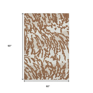 HomeRoots 5' X 8' Versatile Washable Animal Print Rug in Rust and Ivory - Stain Resistant, UV Protected, Durable 669464