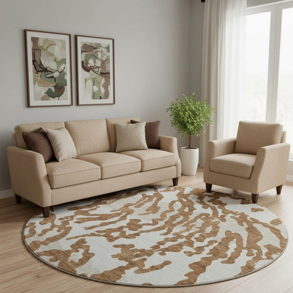 HomeRoots 8' Washable Round Rug with Rust and Ivory Animal Print - UV Protected, Durable, and Stylish Design! 669465