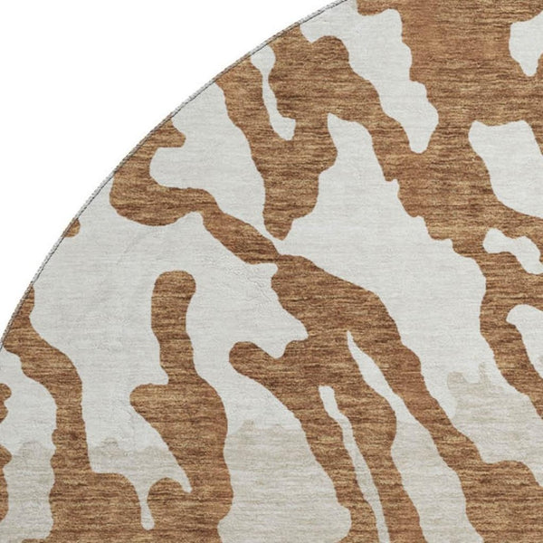 HomeRoots 8' Washable Round Rug with Rust and Ivory Animal Print - UV Protected, Durable, and Stylish Design! 669465