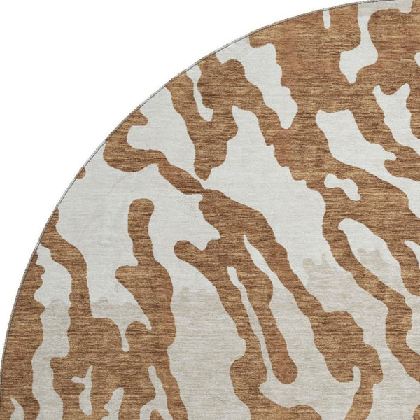 HomeRoots 8' Washable Round Rug with Rust and Ivory Animal Print - UV Protected, Durable, and Stylish Design! 669465