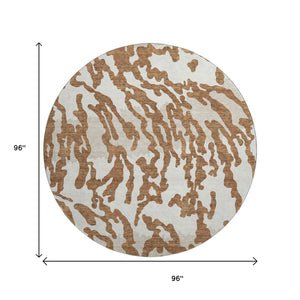 HomeRoots 8' Washable Round Rug with Rust and Ivory Animal Print - UV Protected, Durable, and Stylish Design! 669465