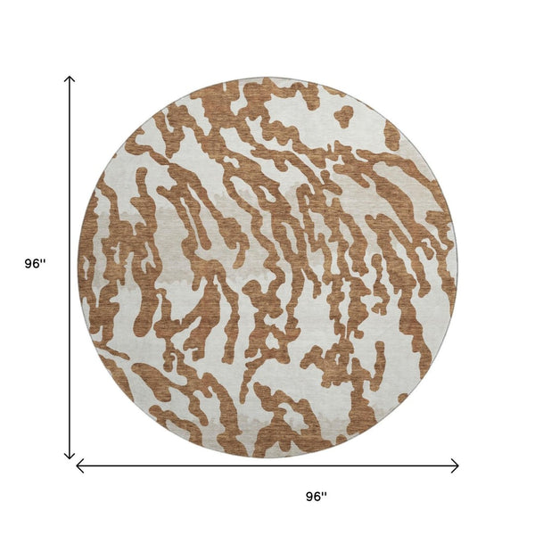 HomeRoots 8' Washable Round Rug with Rust and Ivory Animal Print - UV Protected, Durable, and Stylish Design! 669465