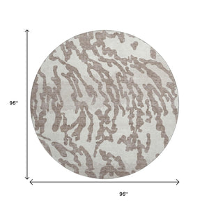 HomeRoots 8' Taupe and Ivory Animal Print Round Rug - Washable, UV Protected, Perfect for High-Traffic Areas 669483