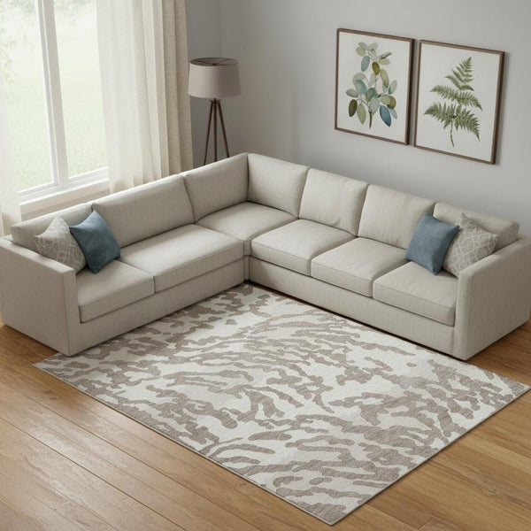 HomeRoots 9' X 12' Taupe and Ivory Animal Print Area Rug - Washable, UV Protected, Perfect for High Traffic Areas 669485