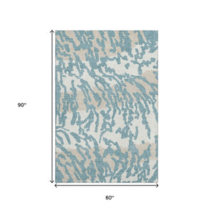 HomeRoots 5' Teal and Ivory Animal Print Area Rug – Washable, UV-Protected, Stain-Resistant for Any Room 669488