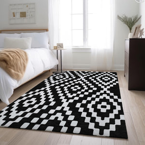 HomeRoots 8' X 10' Black and Ivory Geometric Area Rug – Washable, UV Protected, Durable for High-Traffic Spaces 670782