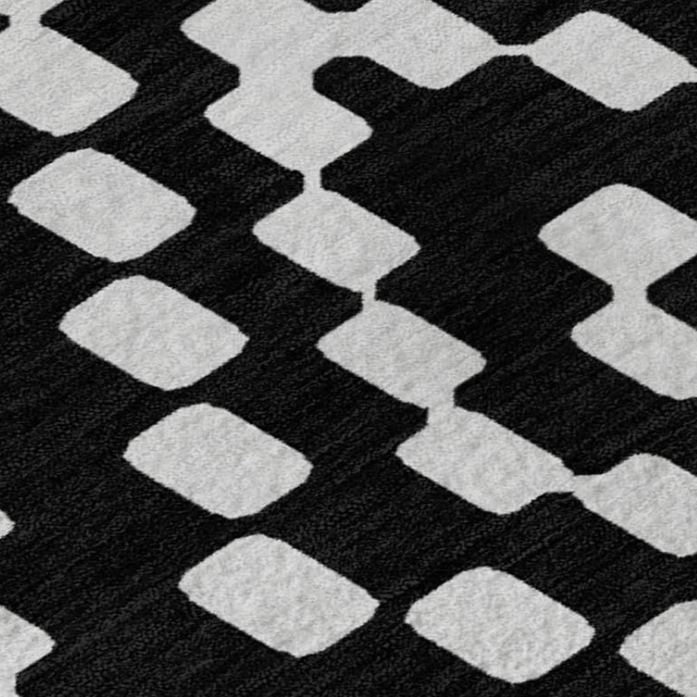 HomeRoots 8' X 10' Black and Ivory Geometric Area Rug – Washable, UV Protected, Durable for High-Traffic Spaces 670782