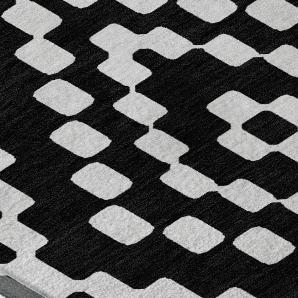 HomeRoots 9' X 12' Modern Black and Ivory Geometric Washable Area Rug with Stain Resistance & UV Protection 670783