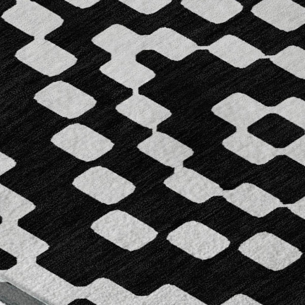HomeRoots 9' X 12' Modern Black and Ivory Geometric Washable Area Rug with Stain Resistance & UV Protection 670783