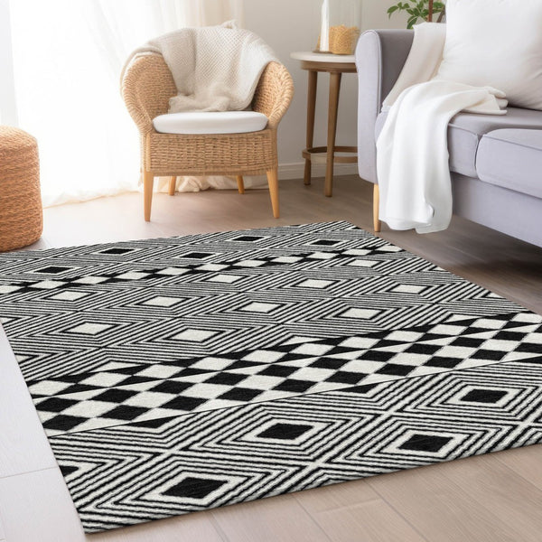 HomeRoots 5' X 8' Black And Ivory Geometric Area Rug – Washable, UV Protected, Durable, Modern Design for Any Space 671356