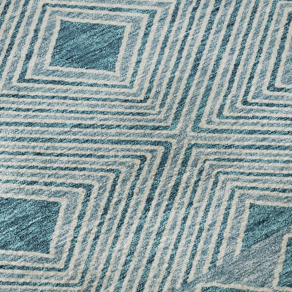 HomeRoots 8' Teal and Ivory Geometric Round Rug - Washable, UV-Protected, and Ideal for Busy Homes! 671411