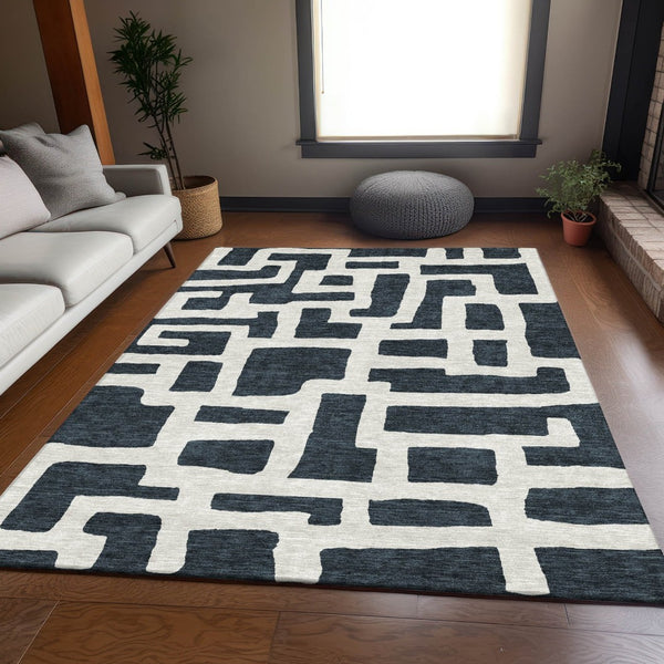 HomeRoots 9' X 12' Black And Ivory Washable Area Rug - Durable Geometric Design with UV Protection for Any Room 671773