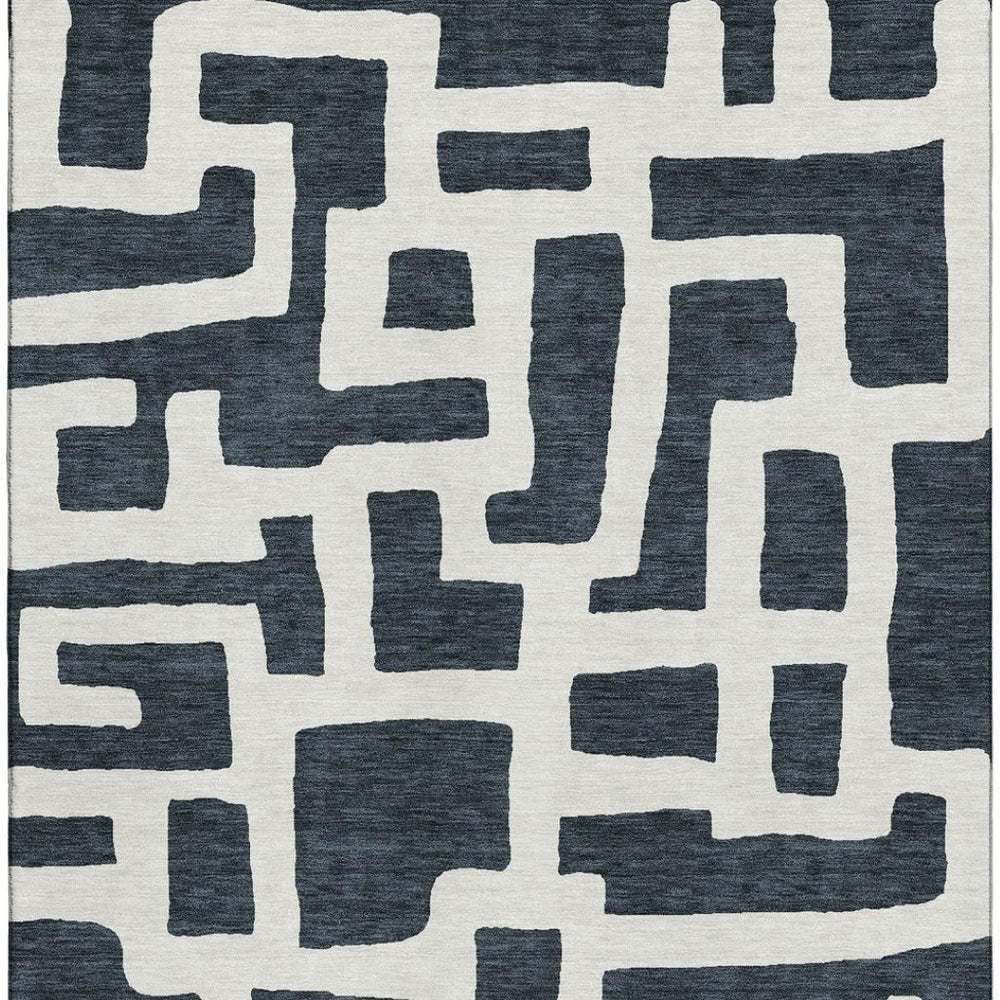 HomeRoots 9' X 12' Black And Ivory Washable Area Rug - Durable Geometric Design with UV Protection for Any Room 671773