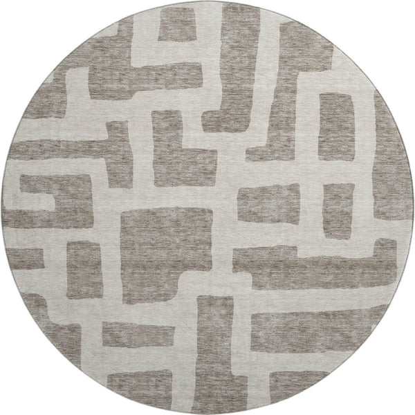 HomeRoots 8' Taupe and Beige Abstract Geometric Round Rug - Washable, UV-Protected, Perfect for High Traffic Areas 671843