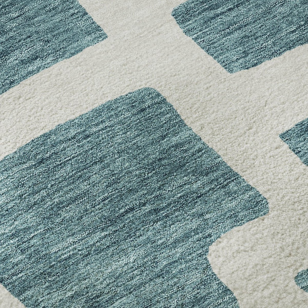 HomeRoots 8' Teal and Ivory Abstract Geometric Round Rug - Durable, Washable, UV-Protected for Modern Spaces 671849