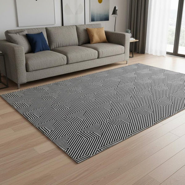 HomeRoots 5' X 8' Black And Ivory Abstract Geometric Washable Area Rug – Stylish, Durable, UV-Protected Design 672310