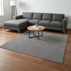 HomeRoots 8' X 10' Modern Black and Ivory Geometric Area Rug - Washable, UV Protected, Perfect for Families! 672312