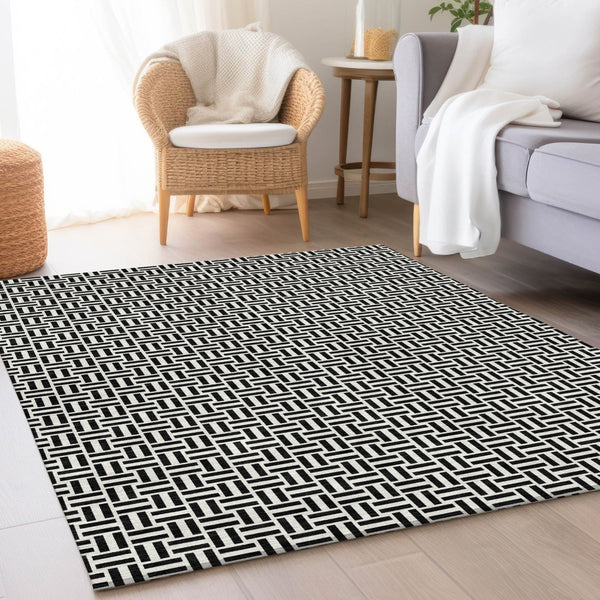 HomeRoots 8' X 10' Black And Ivory Geometric Area Rug - Washable, UV Protected, Durable for High-Traffic Areas 672390