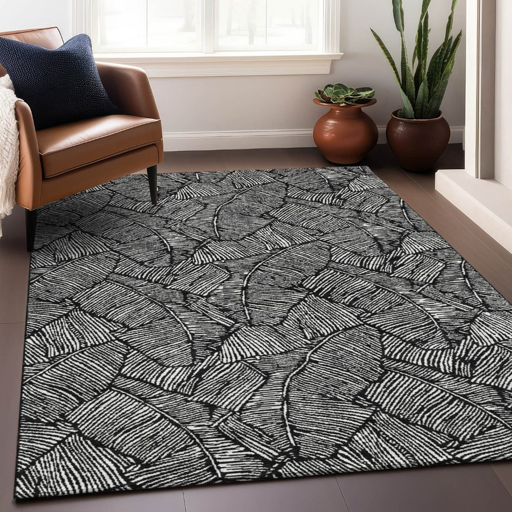 HomeRoots 5' X 8' Black And Ivory Floral Area Rug - Washable, UV Protected, Durable for Homes with Kids & Pets 672583