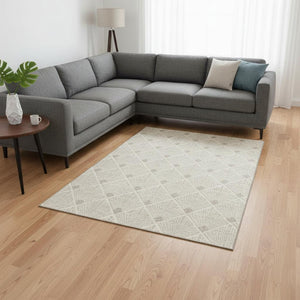 HomeRoots 9' X 12' Beige and Tan Abstract Geometric Area Rug - Washable, UV Protected, Stain Resistant Design 672658