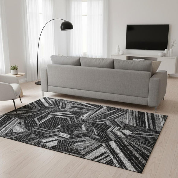 HomeRoots 5' X 8' Black and Gray Geometric Area Rug - Washable, UV Protected, Stain-Resistant for Modern Homes 672733