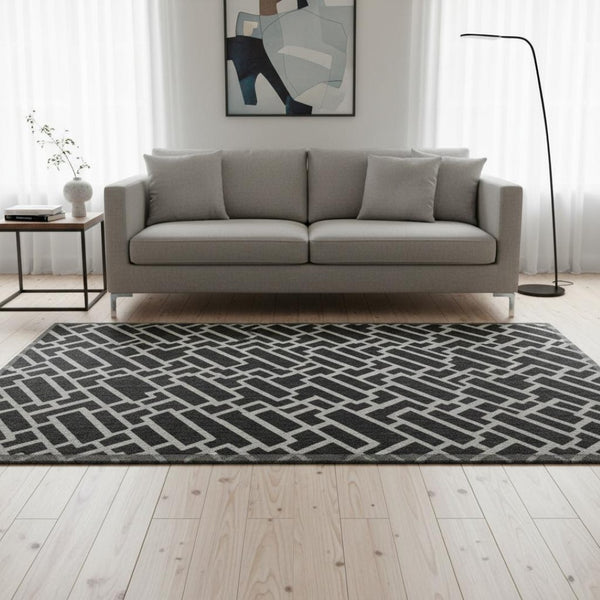 HomeRoots 5' X 8' Black And Ivory Geometric Area Rug - Stylish, Washable, UV Protected for Busy Homes 672811