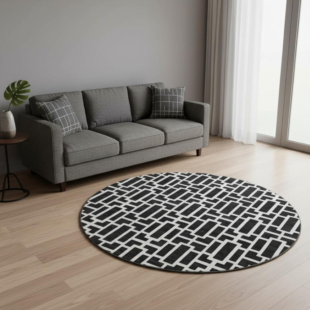 HomeRoots 8' Black And Ivory Geometric Round Rug - Washable, UV Protected, Durable, Modern Design for Any Space 672812